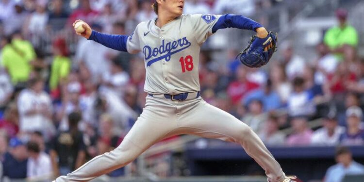 Los Angeles Dodgers pitcher Yoshinobu Yamamoto throws in the first inning of a baseball game.