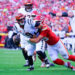 Sep 15, 2024; Kansas City, Missouri, USA; Cincinnati Bengals quarterback Joe Burrow (9) is sacked by Kansas City Chiefs defensive end George Karlaftis (56) during the first half at GEHA Field at Arrowhead Stadium. Mandatory Credit: Denny Medley-Imagn Images