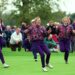 Europe's players run on to the green to celebrate Solheim Cup victory in 1992