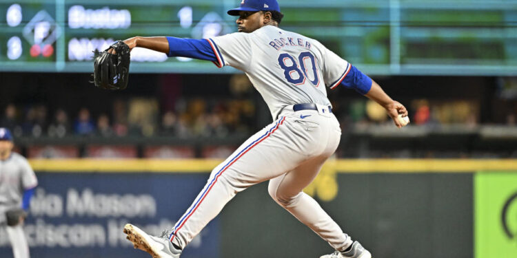 SEATTLE, WASHINGTON - SEPTEMBER 12: Kumar Rocker #80 of the Texas Rangers, making his MLB debut, throws a pitch during the third inning against the Seattle Mariners at T-Mobile Park on September 12, 2024 in Seattle, Washington. (Photo by Alika Jenner/Getty Images)