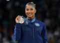 Bronze medalist Jordan Chiles of the United States poses for photos during the victory ceremony of women's floor exercise of artistic gymnastics at the Paris 2024 Olympic Games in Paris, France, Aug. 5, 2024. (Photo by Cao Can/Xinhua via Getty Images)