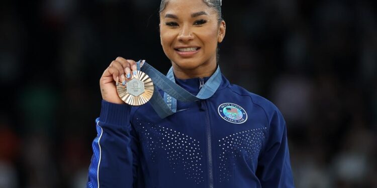 Bronze medalist Jordan Chiles of the United States poses for photos during the victory ceremony of women's floor exercise of artistic gymnastics at the Paris 2024 Olympic Games in Paris, France, Aug. 5, 2024. (Photo by Cao Can/Xinhua via Getty Images)