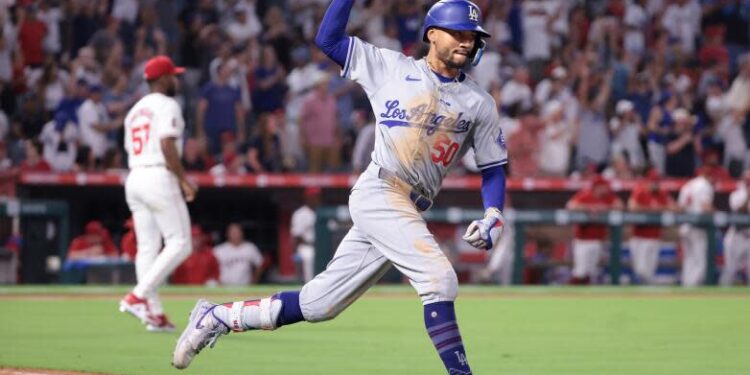 Anaheim, California September 3, 2024-Dodgers Mookie betts celebrates his three-run home run against the Angels in the tenth inning at Anaheim Stadium Tuesday. (Wally Skalij/Los Angeles Times)