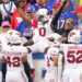 DeeJay Dallas celebrates the NFL's first return touchdown under new kickoff rules. (Gregory Fisher-Imagn Images)