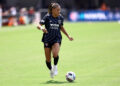 WASHINGTON, DC - AUGUST 25: Trinity Rodman #2 of Washington Spirit dribbles against Kansas City Current at Audi Field on August 25, 2024 in Washington, DC. (Photo by Tim Nwachukwu/Getty Images)