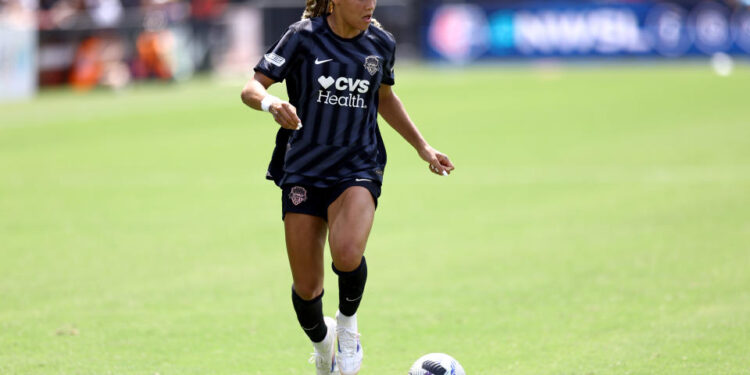 WASHINGTON, DC - AUGUST 25: Trinity Rodman #2 of Washington Spirit dribbles against Kansas City Current at Audi Field on August 25, 2024 in Washington, DC. (Photo by Tim Nwachukwu/Getty Images)