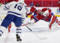 Carey Price makes a diving save in the first round of the 2021 Stanley Cup playoffs. <p>© Eric Bolte-USA TODAY Sports</p>