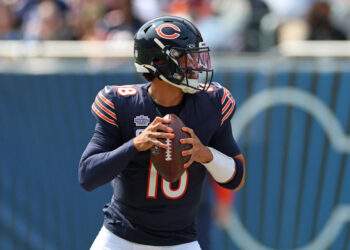 CHICAGO, ILLINOIS - SEPTEMBER 08: Caleb Williams #18 of the Chicago Bears looks to pass during a game against the Tennessee Titans at Soldier Field on September 08, 2024 in Chicago, Illinois.  The Bears defeated the Titans 24-17. (Photo by Stacy Revere/Getty Images)