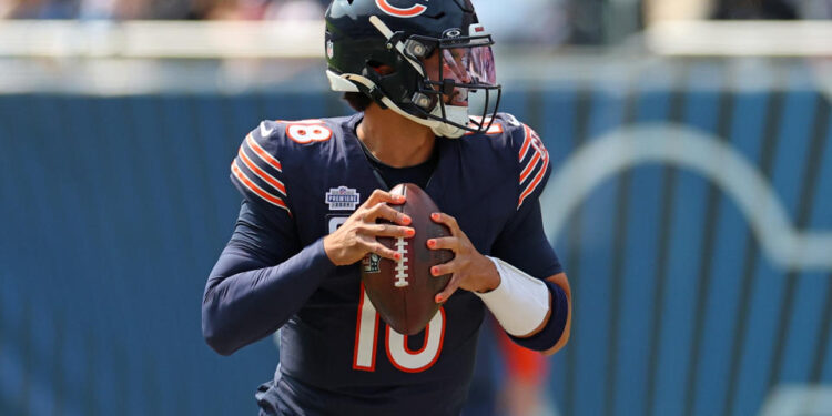 CHICAGO, ILLINOIS - SEPTEMBER 08: Caleb Williams #18 of the Chicago Bears looks to pass during a game against the Tennessee Titans at Soldier Field on September 08, 2024 in Chicago, Illinois.  The Bears defeated the Titans 24-17. (Photo by Stacy Revere/Getty Images)