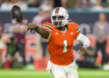 MIAMI GARDENS, FL - SEPTEMBER 27: Miami quarterback Cam Ward (1) does a shovel pass during the college football game between the Virginia Tech Hokies and the University of Miami Hurricanes on September 27, 2024 at the Hard Rock Stadium in Miami Gardens, FL. (Photo by Doug Murray/Icon Sportswire via Getty Images)