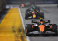 SINGAPORE, SINGAPORE - SEPTEMBER 22: Lando Norris of Great Britain driving the (4) McLaren MCL38 Mercedes leads Max Verstappen of the Netherlands driving the (1) Oracle Red Bull Racing RB20 on track during the F1 Grand Prix of Singapore at Marina Bay Street Circuit on September 22, 2024 in Singapore, Singapore. (Photo by Rudy Carezzevoli/Getty Images)