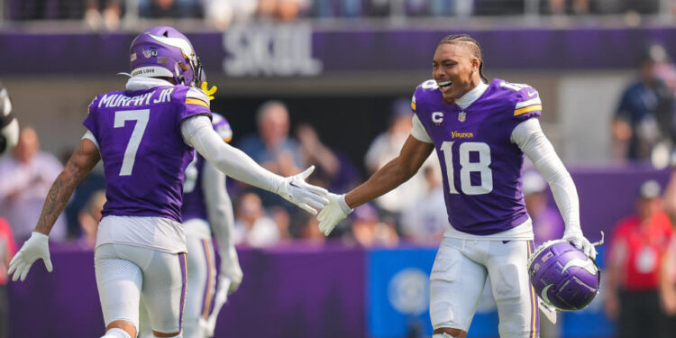 Sep 15, 2024; Minneapolis, Minnesota, USA; Minnesota Vikings wide receiver Justin Jefferson (18) celebrates an interception with cornerback Byron Murphy Jr. (7) against the San Francisco 49ers in the third quarter at U.S. Bank Stadium. Mandatory Credit: Brad Rempel-Imagn Images