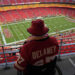 A fan watches warmups at Arrowhead Stadium ahead of the game-delaying storm. (AP Photo/Charlie Riedel)