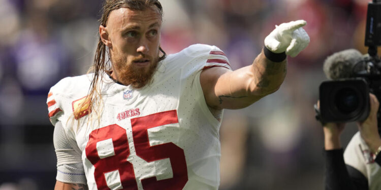 San Francisco 49ers tight end George Kittle (85) reacts to fans before an NFL football game against the Minnesota Vikings, Sunday, Sept. 15, 2024, in Minneapolis. (AP Photo/Abbie Parr)