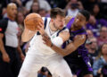 SACRAMENTO, CALIFORNIA - MARCH 26: De'Aaron Fox #5 of the Sacramento Kings guards Luka Doncic #77 of the Dallas Mavericks in the first half at Golden 1 Center on March 26, 2024 in Sacramento, California. NOTE TO USER: User expressly acknowledges and agrees that, by downloading and or using this photograph, User is consenting to the terms and conditions of the Getty Images License Agreement.  (Photo by Ezra Shaw/Getty Images)