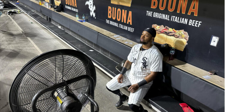 Chicago White Sox's Corey Julks sits in the end of the bench after the team's 5-3 loss to the New York Mets Saturday, Aug. 31, 2024, that saw the White Sox tie the franchise season record of 106 losses in Chicago. (AP Photo/Charles Rex Arbogast)