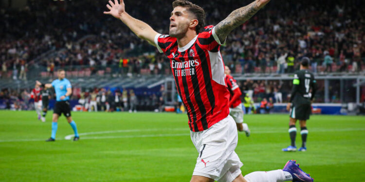 MILAN, ITALY - SEPTEMBER 17: Christian Pulisic of AC Milan celebrates the goal scored during the UEFA Champions League 2024/25 League Phase MD1 match between AC Milan and Liverpool FC at Stadio San Siro on September 17, 2024 in Milan, Italy. (Photo by Vasile Mihai-Antonio/Getty Images)