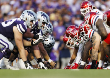 MANHATTAN, KANSAS - SEPTEMBER 13: Kansas State Wildcats offense and Arizona Wildcats defense at the line of scrimmage before an extra point attempt during a game at Bill Snyder Family Football Stadium on September 13, 2024 in Manhattan, Kansas. (Photo by Ric Tapia/Getty Images)