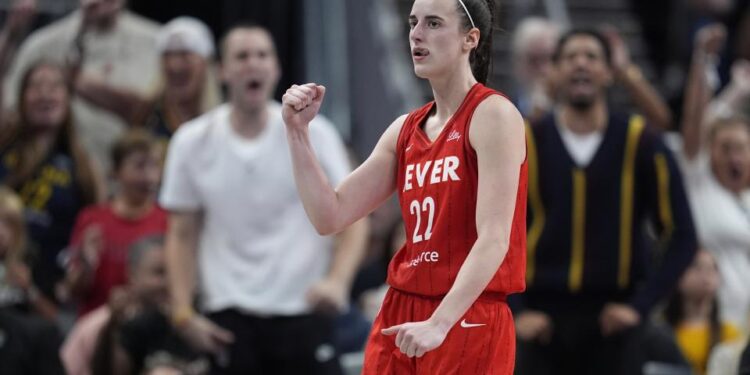 Indiana Fever's Caitlin Clark reacts during the second half of a WNBA basketball game against the Las Vegas Aces, Wednesday, Sept. 11, 2024, in Indianapolis. (AP Photo/Darron Cummings)