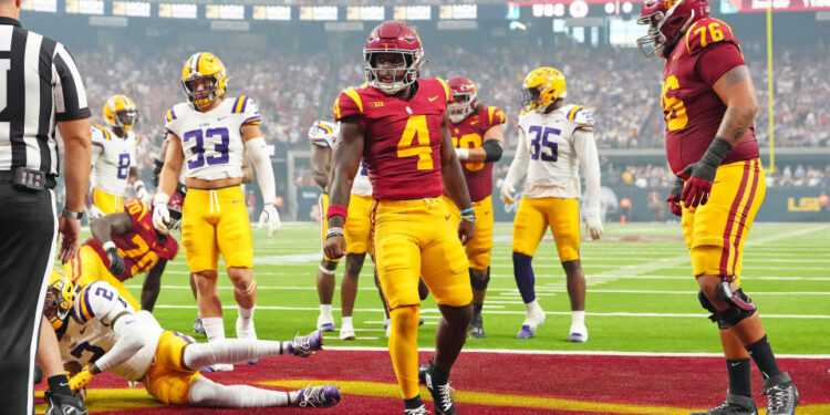 Sep 1, 2024; Paradise, Nevada, USA; Southern California Trojans running back Woody Marks (4) celebrates after scoring a touchdown against the LSU Tigers during the second quarter at Allegiant Stadium. Mandatory Credit: Stephen R. Sylvanie-USA TODAY Sports