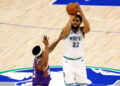 MINNEAPOLIS, MINNESOTA - APRIL 23: Karl-Anthony Towns #32 of the Minnesota Timberwolves shoots against Bradley Beal #3 of the Phoenix Suns in the first quarter of game two of the Western Conference First Round Playoffs at Target Center on April 23, 2024 in Minneapolis, Minnesota. NOTE TO USER: User expressly acknowledges and agrees that, by downloading and or using this photograph, User is consenting to the terms and conditions of the Getty Images License Agreement. (Photo by David Berding/Getty Images)