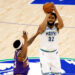 MINNEAPOLIS, MINNESOTA - APRIL 23: Karl-Anthony Towns #32 of the Minnesota Timberwolves shoots against Bradley Beal #3 of the Phoenix Suns in the first quarter of game two of the Western Conference First Round Playoffs at Target Center on April 23, 2024 in Minneapolis, Minnesota. NOTE TO USER: User expressly acknowledges and agrees that, by downloading and or using this photograph, User is consenting to the terms and conditions of the Getty Images License Agreement. (Photo by David Berding/Getty Images)