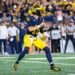 ANN ARBOR, MICHIGAN - AUGUST 31: Davis Warren #16 of the Michigan Wolverines looks to throw the ball downfield during the second half of  a college football game against the Fresno St. Bulldogs at Michigan Stadium on August 31, 2024 in Ann Arbor, Michigan. The Michigan Wolverines won the game 30-10. (Photo by Aaron J. Thornton/Getty Images)