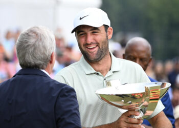 ATLANTA, GEORGIA - SEPTEMBER 01: PGA TOUR Commissioner Jay Monahan awards Scottie Scheffler of the United States the FedEx Cup after winning the TOUR Championship at East Lake Golf Club on September 01, 2024 in Atlanta, Georgia. (Photo by Tracy Wilcox/PGA TOUR via Getty Images)