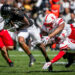 BOULDER, CO - SEPTEMBER 09: Colorado wide receiver Xavier Weaver (10) attempts to split the tackle of Nebraska Defensive back Quinton Newsome (6) and Defensive back DeShon Singleton (8) during the home opener game between the Colorado Buffaloes and the the Nebraska Cornhuskers on Saturday, September 9, 2023 at Folsom Field in Boulder, CO.  (Photo by Nick Tre. Smith/Icon Sportswire via Getty Images)