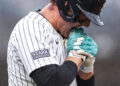 Anthony Rizzo #48 bites his hand after being hit by a pitch during the seventh inning of the game against the Pittsburgh Pirates. (Dustin Satloff/Getty Images)