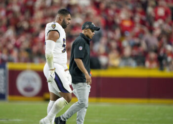 Kyle Van Noy walks of the field after fracturing an orbital bone against the Chiefs last week. (AP Photo/Charlie Riedel)