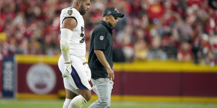 Kyle Van Noy walks of the field after fracturing an orbital bone against the Chiefs last week. (AP Photo/Charlie Riedel)