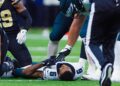 DeVonta Smith lays on turf