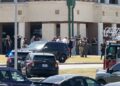 Law enforcement officers work at the scene of a shooting at Apalachee High School