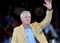 Brett Favre waves to a crowd