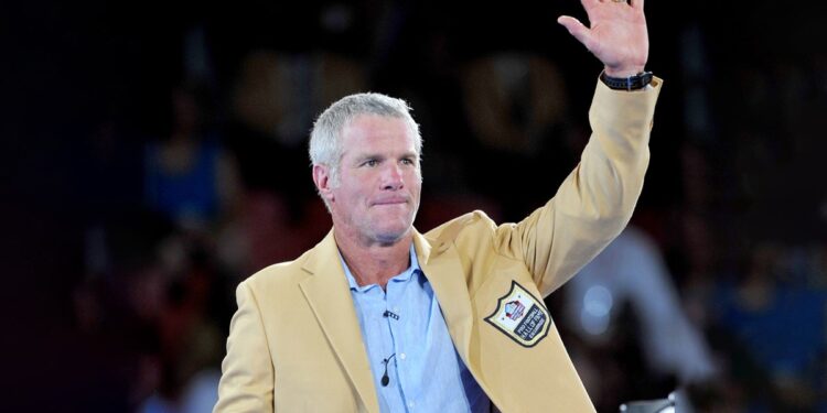 Brett Favre waves to a crowd