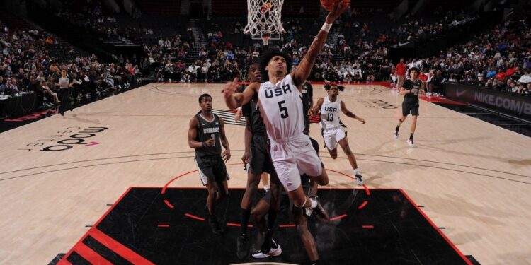 Dylan Harper of Team USA drives to the basket during the game against Team World during the 2024 Nike Hoop Summit on April 13, 2024 at the Moda Center Arena in Portland, Oregon.