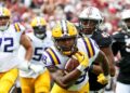 LSU player runs with the football