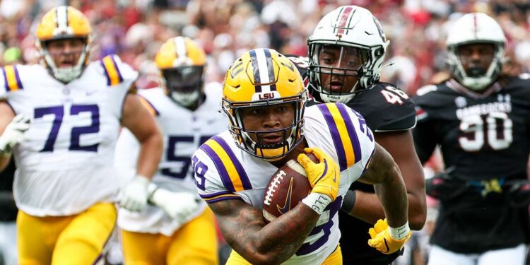 LSU player runs with the football