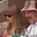 Taylor Swift takes a sip of her drink while seated next to Kansas City Chiefs tight end Travis Kelce on the final day of the U.S. Open tennis tournament, Sept. 8, 2024.