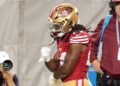 San Francisco 49ers running back Jordan Mason reacts after a run against New York Jets safety Chuck Clark during the fourth quarter at Levi's Stadium.