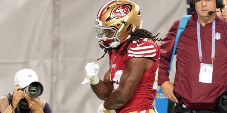 San Francisco 49ers running back Jordan Mason reacts after a run against New York Jets safety Chuck Clark during the fourth quarter at Levi's Stadium.