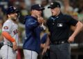 Joe Espada and Jose Altuve argue with umpire