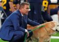 Kirk Herbstreit walks with his dog