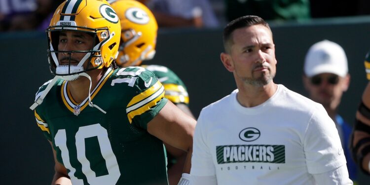 Matt LaFleur walks on field