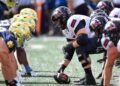 College football players lineup before a snap