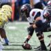 College football players lineup before a snap