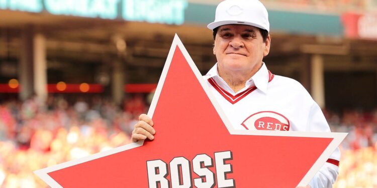 Pete Rose poses with retired number