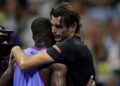 Taylor Fritz hugs Frances Tiafoe