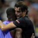 Taylor Fritz hugs Frances Tiafoe